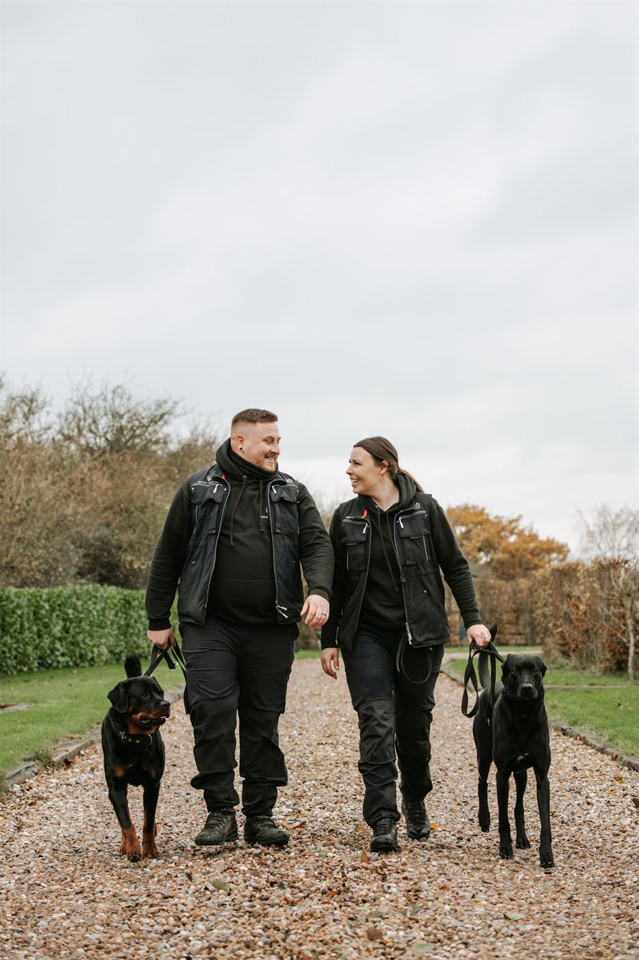 Dog training session with owners and trainers.